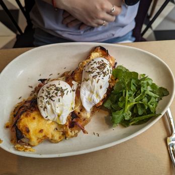 L'Amico - Two poached eggs over toast with cheese - Italian Near Me - New York, New York