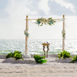 The beautiful Caribbean Blue décor package with a curved fern aisle.  At beautiful Treasure Island in St. Pete, Florida!