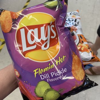 Circle K - a hand holding a bag of chips - Convenience Stores Near Me - Brunswick, Georgia