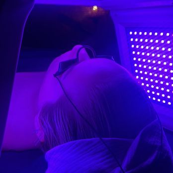 Sacred Esthetics - Client receiving light therapy and auricular acupuncture. - Estheticians Near Me Sacred Esthetics - Client receiving light therapy and auricular acupuncture. - Estheticians Near Me