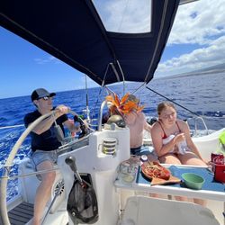 Kona Sail Charters - Taking a guest spin at the helm