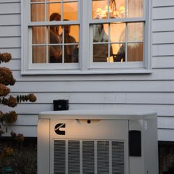 Anderson Water-Power-Air - A Cummins home standby generator keeping the lights on for a family during a nighttime power outage.