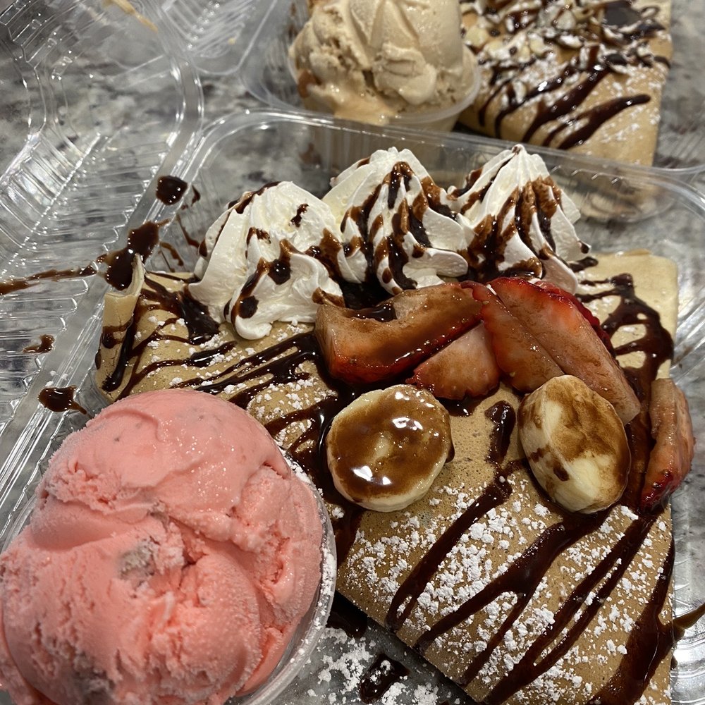 Strawberry and banana Nutella and Almond Nutella crepe Strawberry and banana Nutella and Almond Nutella crepe