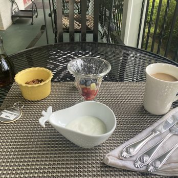 Monroe Manor Inn Bed & Breakfast - Yogurt, fruit, organic granola (not sure if GF), and coffee to start while waiting on the hot breakfast - Hotels Near Me - South Haven, Michigan