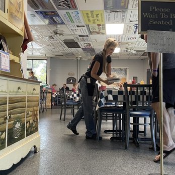 Mel Dog's Cafe - a woman walking through the store - Breakfast & Brunch Near Me - Elk Grove, California
