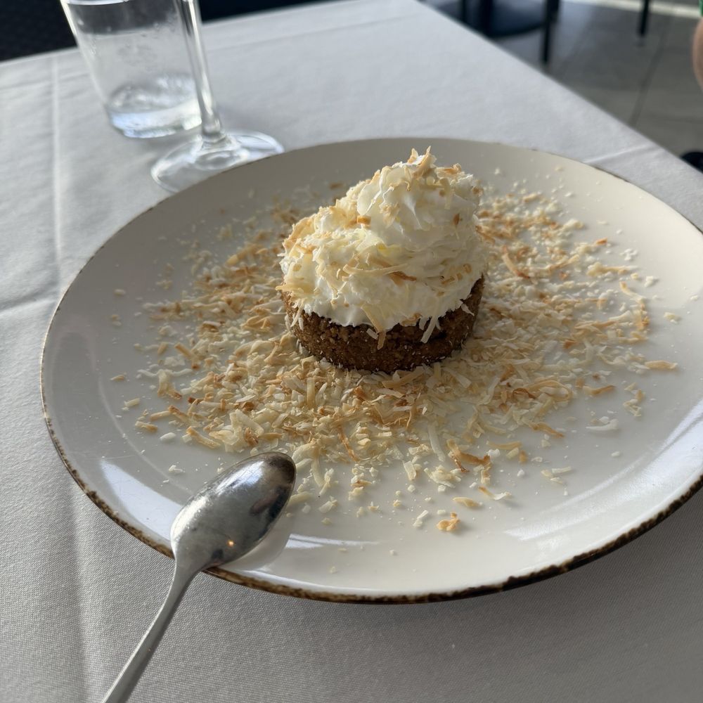 The Deck @ 560 - Key lime tart with toasted coconut. We asked for extra coconut. It was so delicious! - New American Near Me - Marco Island, Florida The Deck @ 560 - Key lime tart with toasted coconut. We asked for extra coconut. It was so delicious! - New American Near Me - Marco Island, Florida