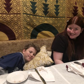 Shokran Moroccan Restaurant - Kids enjoying the comfy Moroccan benches. Upscale seating. - Moroccan Near Me - Chicago, Illinois Shokran Moroccan Restaurant - Kids enjoying the comfy Moroccan benches. Upscale seating. - Moroccan Near Me - Chicago, Illinois