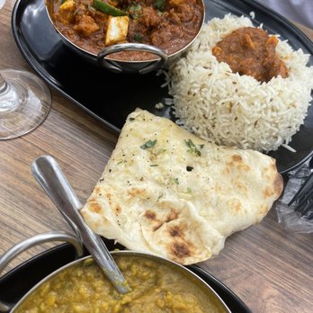 Tarka Indian Kitchen - Chicken Tiki masala, garlic naan, lower= lentils - Indian Near Me - Houston, Texas Tarka Indian Kitchen - Chicken Tiki masala, garlic naan, lower= lentils - Indian Near Me - Houston, Texas