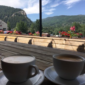 Loaded Joe's - Avon Restaurants - beautiful view on the porch with a caramel macchiato (left) and breve latte (right) - Coffee & Tea Near Me - Avon, Colorado Loaded Joe's - Avon Restaurants - beautiful view on the porch with a caramel macchiato (left) and breve latte (right) - Coffee & Tea Near Me - Avon, Colorado