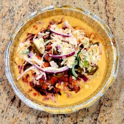 Sweet Fire Donna's - Their Nachos sauce has a fiery cheese sauce, their Original BBQ Sauce, pico de gallo, jalapeños and creamy coleslaw.