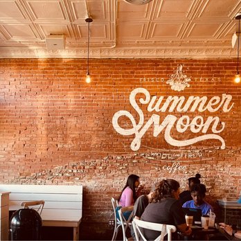 Summer Moon Coffee - people sitting at tables in front of a brick wall - Coffee & Tea Near Me - Frisco, Texas Summer Moon Coffee - people sitting at tables in front of a brick wall - Coffee & Tea Near Me - Frisco, Texas
