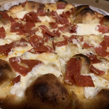 Red Tractor Pizza - Make our own.  Pepperoni, garlic paste, parmigiana cheese, mozzarella cheese - Pizza Near Me - Bozeman, Montana