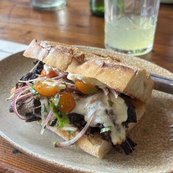 Manuela - Barbacoa Sandwich and a Green Apple Pressed Juice - New American Near Me - Los Angeles, California Manuela - Barbacoa Sandwich and a Green Apple Pressed Juice - New American Near Me - Los Angeles, California
