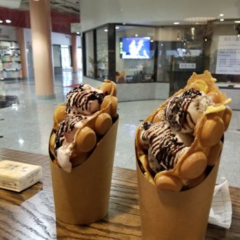 Ball Ball Waffle - Two waffles with one scoop of ice cream each. Strawberry on the left, cookies and cream on the right. - Hong Kong Style Cafe Near Me - Cleveland, Ohio