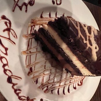 Texas de Brazil - Delicious multi layer chocolate cake. We enjoyed EVERY bite. - Brazilian Near Me - Schaumburg, Illinois