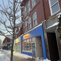 Winter on Maine Street Brunswick, toy store lit up for holiday season