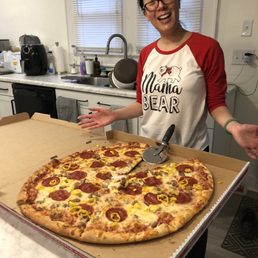 22" pizza with pepperoni, garlic sausage crumble, and banana yellow peppers 22" pizza with pepperoni, garlic sausage crumble, and banana yellow peppers