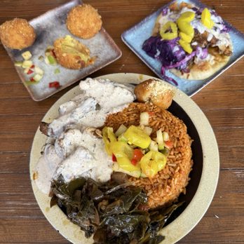 Yum Village - Food Truck Village Combo (garlic parm chicken served w/ truffle oil greens, corn cakes, & turmeric rice), Jerk Chicken Taco - Caribbean Near Me - Detroit, Michigan