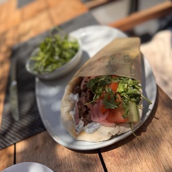 Plateia - Harissa spiced lab pita with arugula salad - Mediterranean Near Me - Los Angeles, California Plateia - Harissa spiced lab pita with arugula salad - Mediterranean Near Me - Los Angeles, California