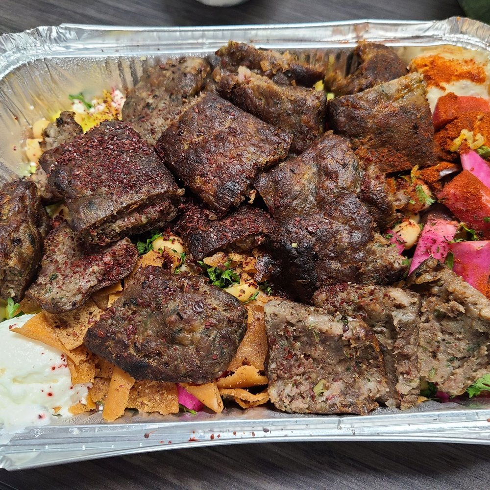 Bowl with lots of shish kafta, rice, fun veggies, garlic and two types of hummus. Bowl with lots of shish kafta, rice, fun veggies, garlic and two types of hummus.