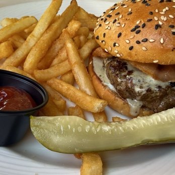 Guppys on the Beach - Guppy's Burger is cooked well, offering a delightful combination of flavors and a generous portion size. - Seafood Near Me - Indian Rocks Beach, Florida Guppys on the Beach - Guppy's Burger is cooked well, offering a delightful combination of flavors and a generous portion size. - Seafood Near Me - Indian Rocks Beach, Florida