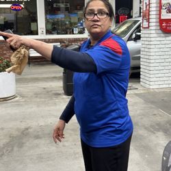 Mobil - The lady telling me to take my trash elsewhere not to throw waste here while pumping gas 