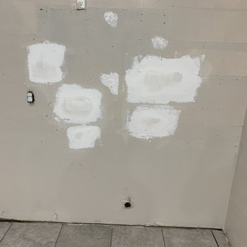 Stone Age Tile - Holes I had to have patched - Flooring Near Me - Anaheim, California