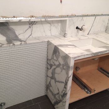 The Stone Shop - Custom Countertop transitioning into Shower Niche - Calacatta Marble - Building Supplies Near Me - Union, New Jersey The Stone Shop - Custom Countertop transitioning into Shower Niche - Calacatta Marble - Building Supplies Near Me - Union, New Jersey