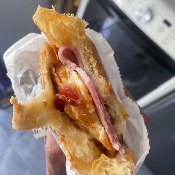 Donut Island - Love this spot but this egg cheese ham breakfast sandwich kinda flimsy for the price. Straight up one slice of ham. Not much cheese. - Bakeries Near Me - Long Beach, California