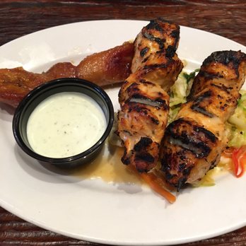 Artesano Peruvian Fusion - Grilled chicken breast skewers (juicy) with a small side of plantains and cilantro lime crema ($8.29) - Latin American Near Me - San Francisco, California