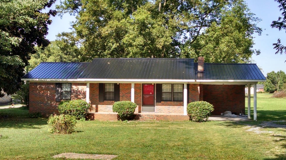 Slide of JC Metal Roofing