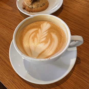 Fourscore Coffee House - Coffee art of a plant with warm chocolate chip cookies. - Coffee & Tea Near Me - Roseville, California