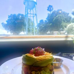 This is the Veggie Tower Breakfast with eggs, rice, beans, sour cream , cheese ,grilled veggies and fresh salsa on top!