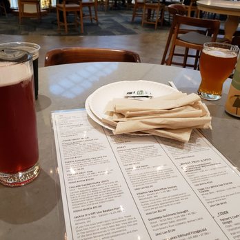 Andy’s Pizza - Tysons - Beer menu with a sour beer on the front left, stout in the back left, and IPA on the right. - Pizza Near Me - McLean, Virginia