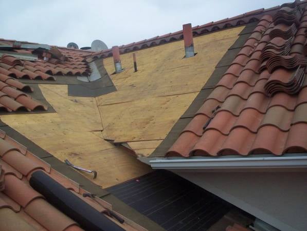 Slide of Caye Works Roofing