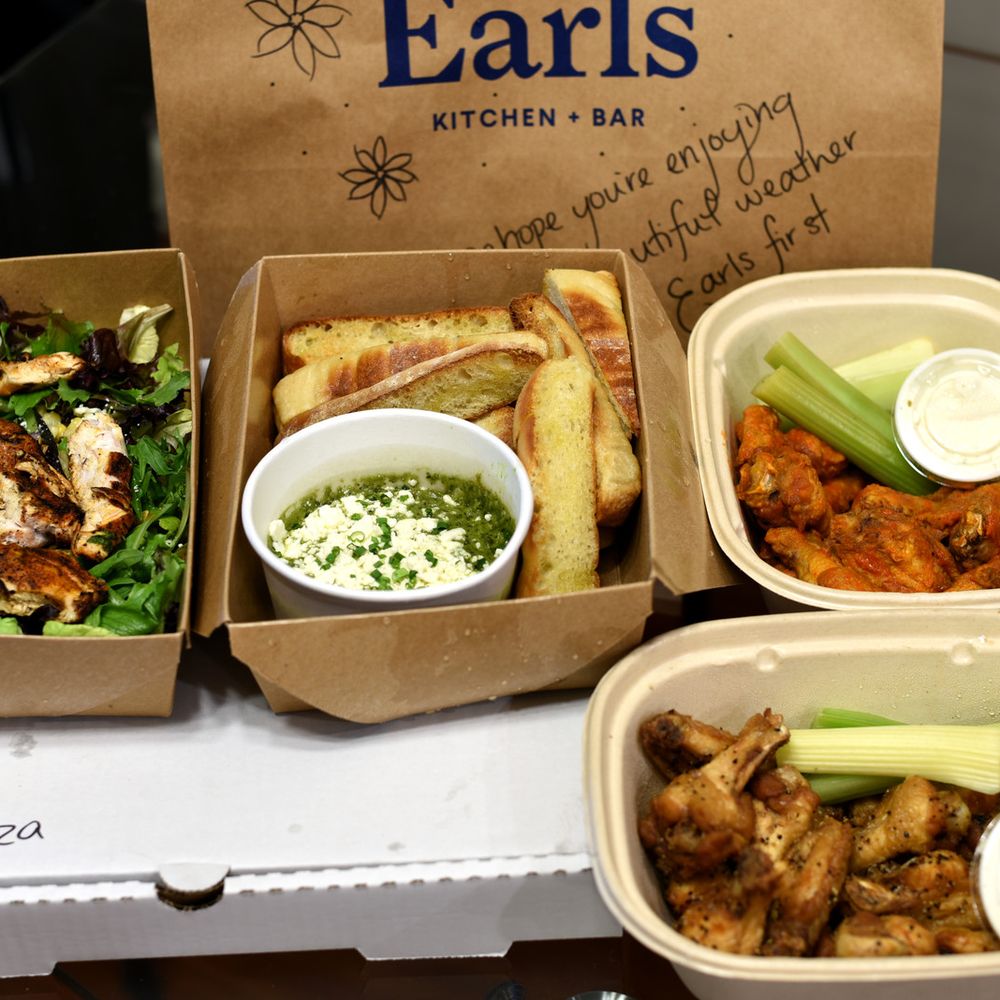 Earls Kitchen + Bar - three take out boxes of food - Canadian (New) Near Me - Vancouver, British Columbia Earls Kitchen + Bar - three take out boxes of food - Canadian (New) Near Me - Vancouver, British Columbia