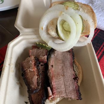 True Texas BBQ - Tender, juicy, generous slices of brisket piled on a bun for a delicious sandwich. - Barbeque Near Me - Pleasanton, Texas