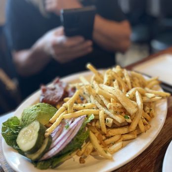 Wood Tavern - a plate of french fries and a sandwich - New American Near Me - Oakland, California