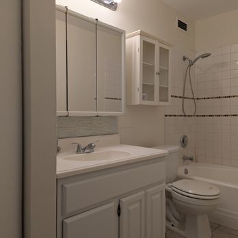 A Little Paint - The finished bathroom, with all cabinets and walls bright and painted. - Painters Near Me