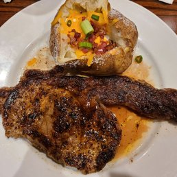 Medium well Ribeye, loaded baked potato