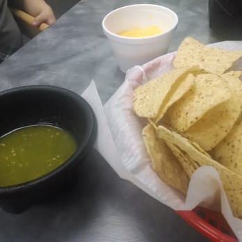Cilantro Tacos - Chips & salsa with a cup of cheese that the owner brought out for my son. - Tacos Near Me - Newberry, Florida Cilantro Tacos - Chips & salsa with a cup of cheese that the owner brought out for my son. - Tacos Near Me - Newberry, Florida