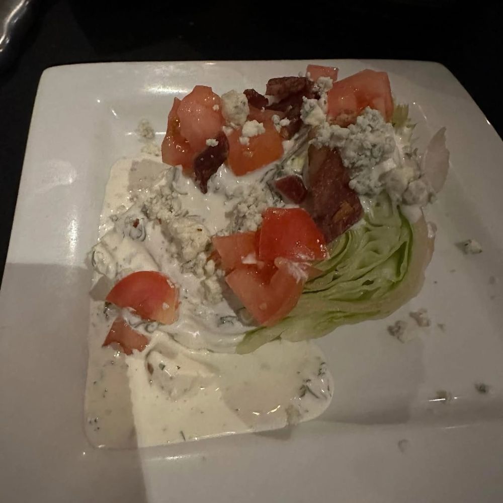 V's Steakhouse - 1/2 of Wedge salad (my husband and I split it) - Steakhouses Near Me - Mabank, Texas V's Steakhouse - 1/2 of Wedge salad (my husband and I split it) - Steakhouses Near Me - Mabank, Texas