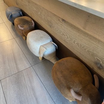 It's Tea 乃茶 - ow of wooden elephants - Bubble Tea Near Me - Burnaby, British Columbia