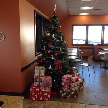 Dunkin' -  a christmas tree with presents in front of it - Donuts Near Me - Bourne, Massachusetts