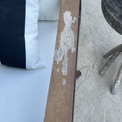 Rooms To Go - Richmond - Peeling arm on third patio chair.