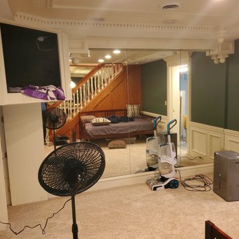 N&M Floors - a living room with a fan in the foreground - Flooring Near Me N&M Floors - a living room with a fan in the foreground - Flooring Near Me