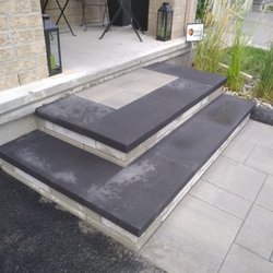 Lionheart Contracting - Paver walkway leading up to an interlock dual-colour step