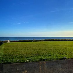 Beach House Hotel - Views of the lawn and ocean from the dining room
