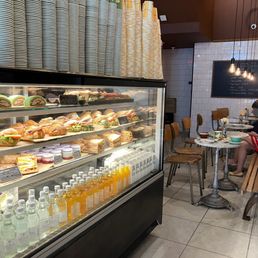 Inside sandwiches and drinks display and seating in the back Inside sandwiches and drinks display and seating in the back