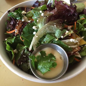 Thrive Bowls - a bowl of salad with dressing - Food Trucks Near Me